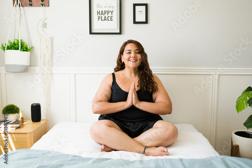 Hispanic fat woman meditating and relaxing