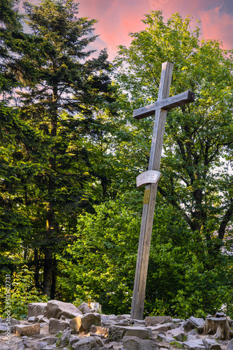 Lysica Mount peak with memorial cross near Swieta Katarzyna village and Bodzentyn at tourist path across Swietokrzyskie Mountains in Poland