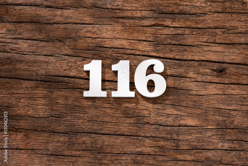 Number 116 - piece on rustic wood background