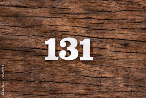 Number 131 in wood, isolated on rustic background