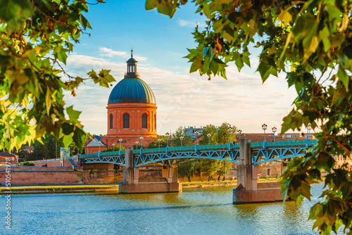 Vibrant landscape at sunset along the Garonne River and La Grave dome in Toulouse, France