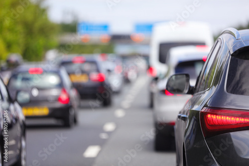 Traffic jam congestion with rows of cars on highway or motorway in rush hour