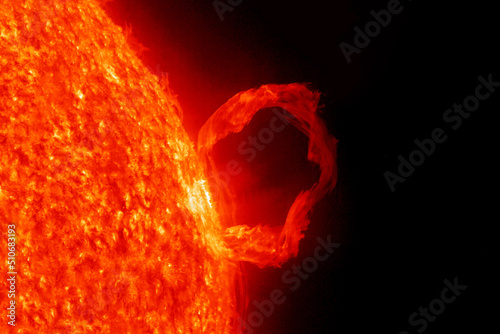 Flash in the sun, on a dark background. Elements of this image furnished by NASA