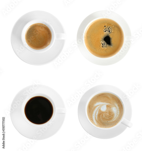Set with cups of hot aromatic coffee on white background, top view