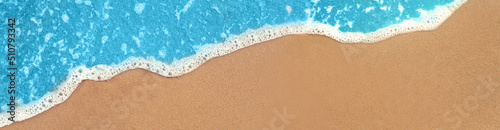 Beach and waves from top view. Turquoise water background from top view. Summer seascape from air. Travel concept and idea