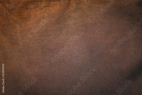 brown background fabric with vintage grunge background texture with black scuffed edges and old faded antique design has copy