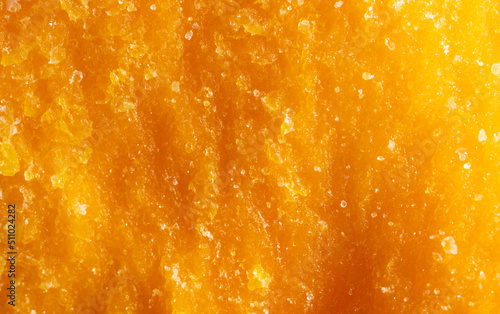 Dried mango pulp as a background.