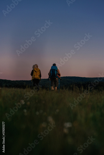Hiker couple with backpackers on mountain
