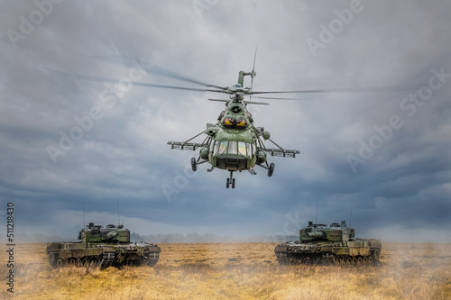 Śmigłowiec Mi-17 przelatujący nad czołgmai. Śmigłowiec i czołgi. Śmigłowiec przelatujący nisko. Śmigłowiec przelatujący nisko nad czołgami. Ochrona granicy białoruskiej.
