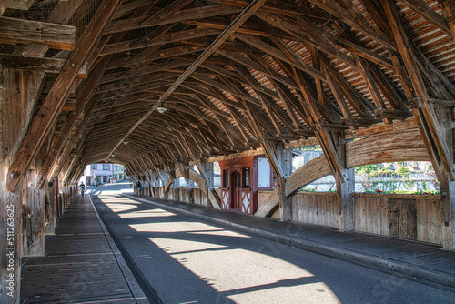 Low angle view inside of medieval wooden bridge of Bremgarten over Reuss river at day time in Switzerland, canton Aargau.