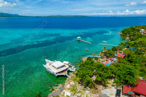 Calape, Bohol - Aerial of the coastline of Pangangan Island, with the islands of Sandingan and Cabilao visible in the horizon.