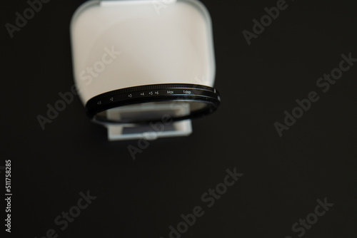 filter neutral density on a black background. vario ND filter. view from above