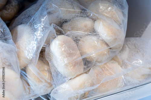 Frozen bread in the refrigerator. ciabatta, loaf, hamburger buns