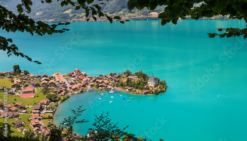 High view over the village of Inseltwald at the turquoise Brienz Lake in Switzerland.