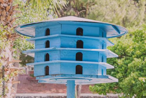 Wooden dovecote in the city park. Taking care of animals and birds