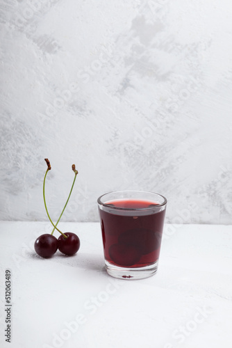 Ginjinha or Ginja. Portuguese liqueur made by infusing ginja berries (sour cherry, Prunus cerasus austera, Morello cherry) in alcohol and adding sugar