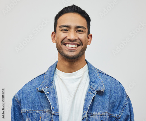 Its a good day to smile. Cropped portrait of a handsome young man posing in studio against a grey background.