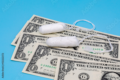 Tampons and cash money. Tampon shortage, tax, pink tax and feminine hygiene products price increase concept