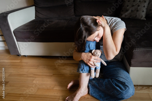 Perinatal loss reproductive chalenge concept - female holding a teddy bear toy