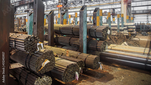 Hot rolling steel in warehouse of iron foundry.