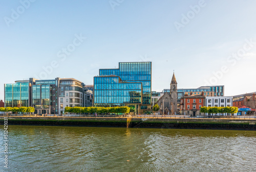 River Liffey waterfront and Church of the Immaculate Heart of Mary in Dublin, Ireland