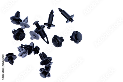 Car body plastic push pin fasteners on white background.