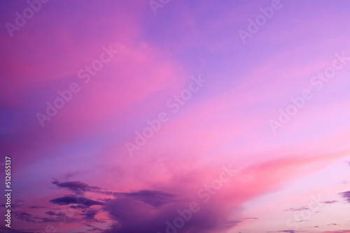 Purple sky background with clouds at sunset on a summer evening 