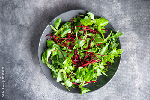 beet salad green leaves mix beetroot, mache leaves, cress fresh healthy meal food snack diet on the table copy space food background rustic 