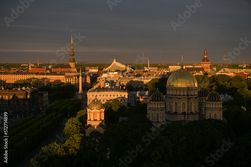 Amazing summer sunrise over the central district of Riga, with view to Freedom Monument, Old town and Cathedral. Landmarks of Latvia.