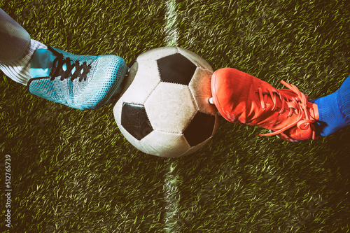 Two soccer players challenge each other at the stadium