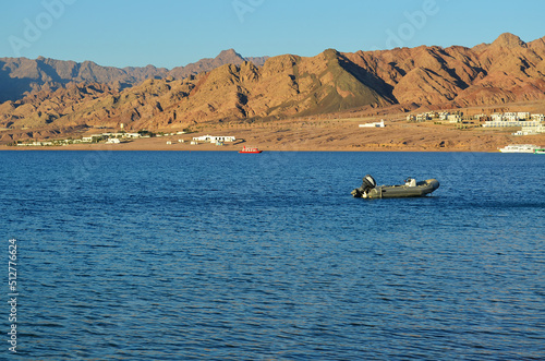 The view of Dahab lagoon in the background of distant mountains. The Sinai peninsula, Egypt.