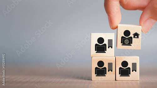 Hybrid workplace schedule, Gig economy, Freelance, Online business network communication, teamwork, home office concept. Hand hold wooden cube icon of gig economy, copy space for background or text.