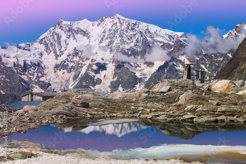 Amazing and romantic view of alpine lake with Monte Rosa in the background at dusk, Piedmont Italy