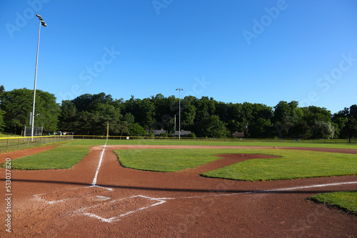 A wide angle view of baseball field shot early in the morning.