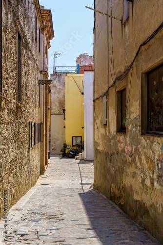 Badalona, Spain - June 18, 2020 . View of old street in Dalt la Vila, building with colored facade, historic center of Badalona, province of Barcelona, Spain.