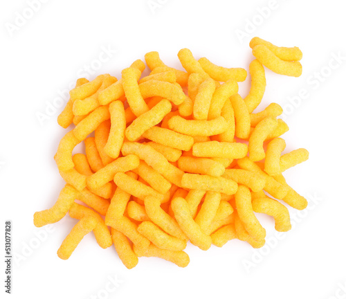 Many tasty cheesy corn puffs isolated on white, top view