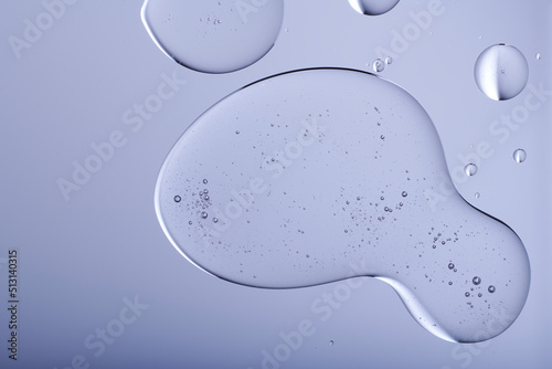 Blob with bubbles and clear formulation on a transparent background. Clear liquid with bubbles resembling glycerin, hyaluronic acid or keratin in laboratory or scientific setting. 