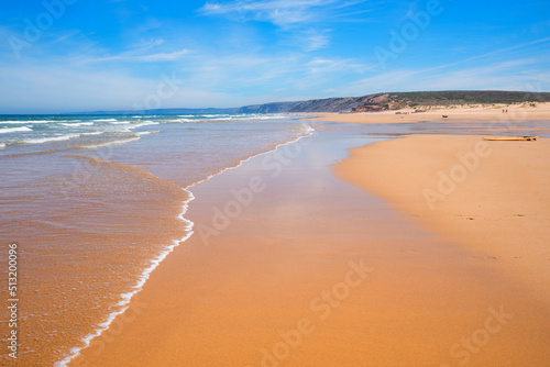 sandy bay Praia do Bordeira with outgoing waves, portugal coast algarve