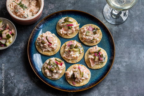 Party canapes, blinis with salmon spread