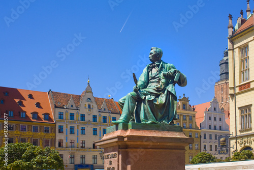 Old Statue of the Polish poet, playwright and comedy writer Aleksander Fredro on the Market Square in front of the Town Hall of Wroclaw, Poland