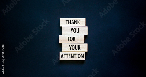 Thank you for attention symbol. Concept words Thank you for your attention on wooden blocks on a beautiful black table black background. Copy space. Business and thank you for attention concept.