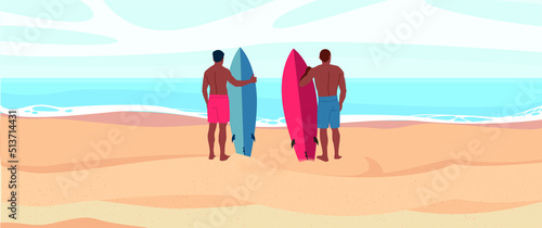 Two men in shorts with a serf board or surfboard on a sunny day at the beach. Beautiful view on the ocean.