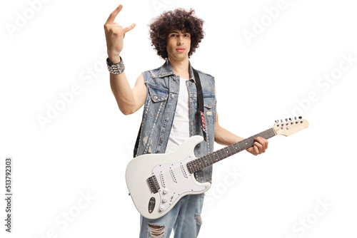 Male musician with a white electric guitar gesturing rock and roll sign