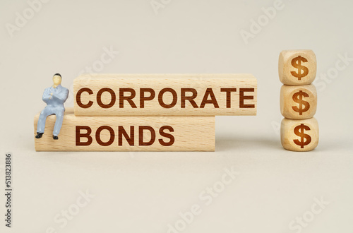 On the blocks with the inscription - CORPORATE BONDS, the figure of a businessman sits, next to the cubes