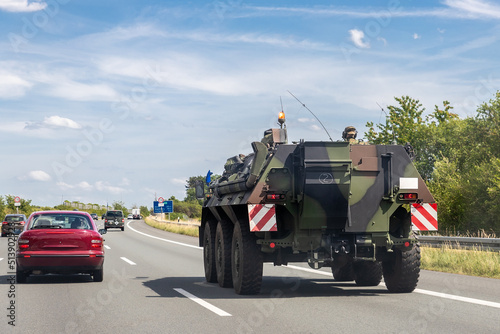 German armoured personnel carrier Fuchs drives military convoy highway road. NATO troops moving reloceation for rapid reaction force reinforcement in eastern Europe