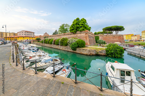 Boats line the crowded canals of the Venezia Nuova area next to the New Fortress at the seafront Tuscan city of Livorno, Italy.