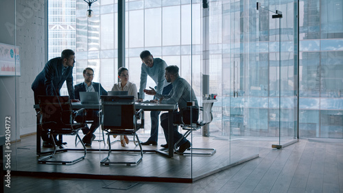 Young professionals having a discussion at a meeting in a modern office