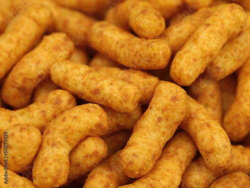 Peanut flips close up, corn puffs snack background