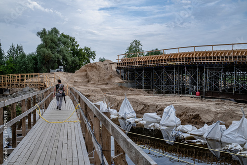 temporary wooden bridge on construction site over Platone river, Jelgava, Latvia