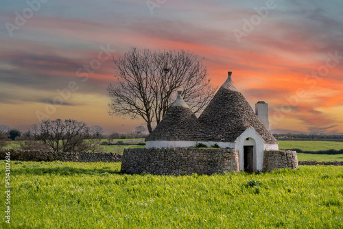 Scenic Trullo dwelling in the rural landscape near Alberobello, Italy